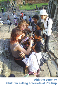 Children selling bracelets at Pre Rup before sunset