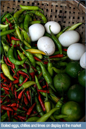 Photo of chillies, boiled eggs and limes in a fresh market in Hoi An, Vietnam Photo of chillies, boiled eggs and limes in a fresh market in Hoi An, Vietnam