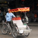 Taking a cyclo in Hanoi