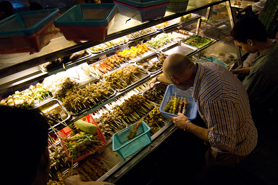 Picking skewers from 19th Street China Town BBQ in Yangon